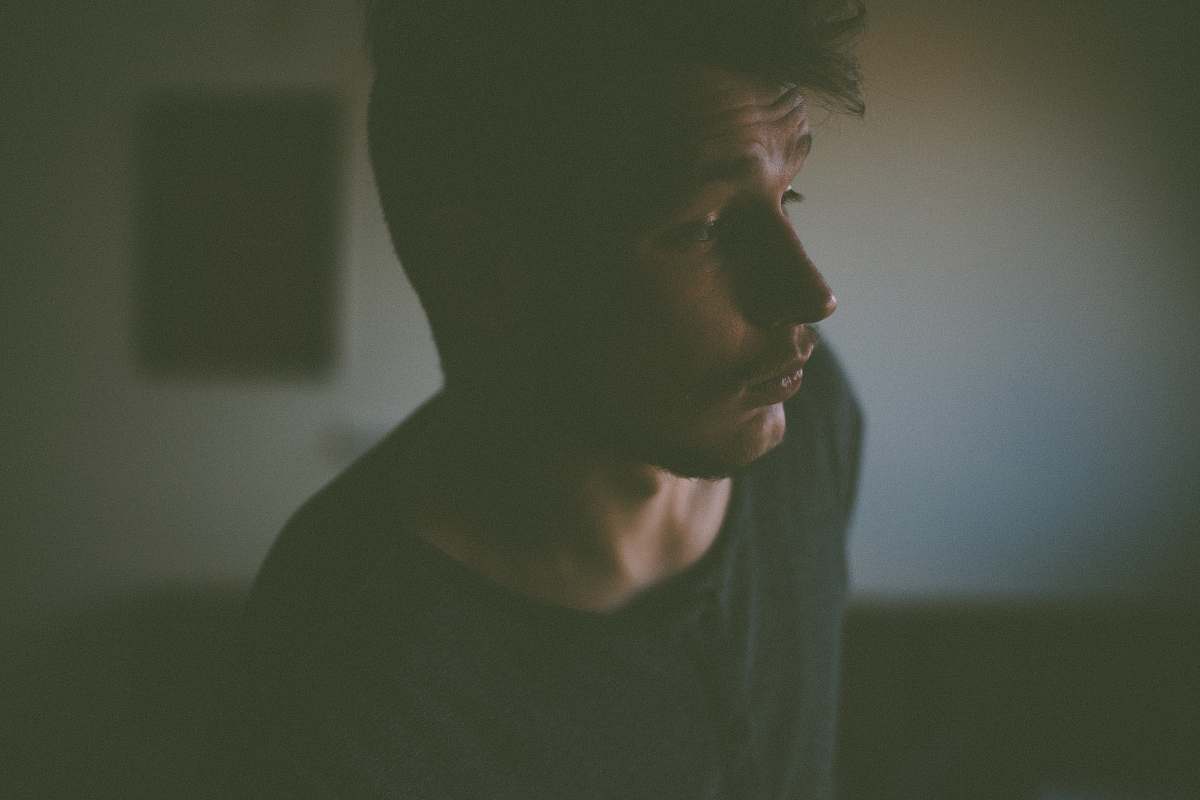 people man in black shirt inside room human