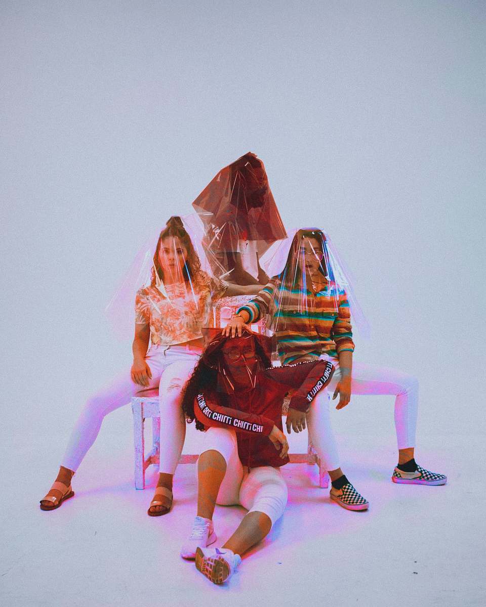 orlando four person sitting on chair with plastic bag covering their heads united states
