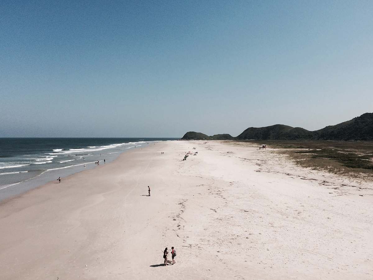 sea people on seashore at daytime ocean