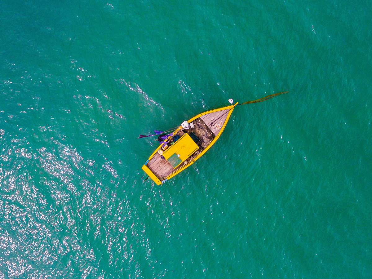 ocean aerial view photography rowboat on body of water boat