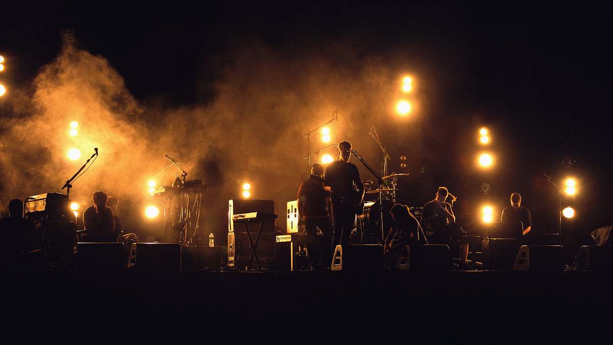 music photo of band playing on stage band