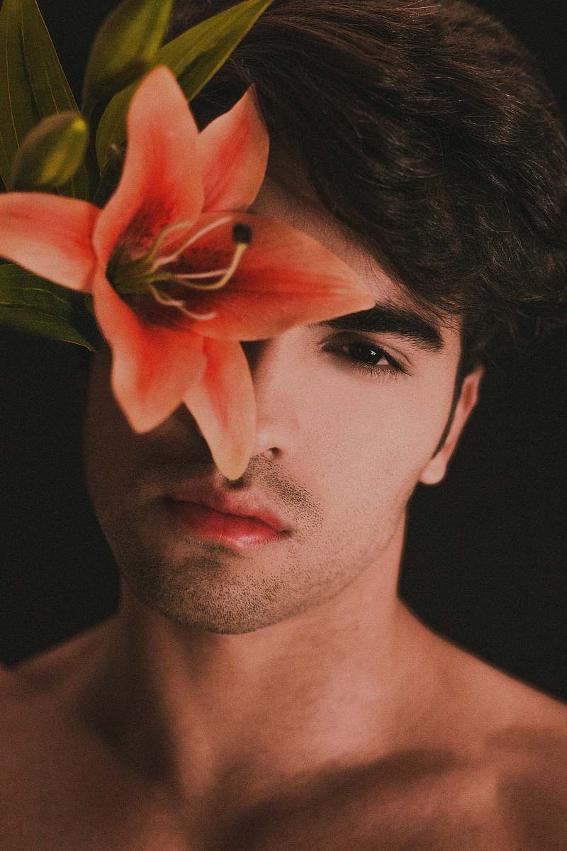 people topless man with pink flower on ear model