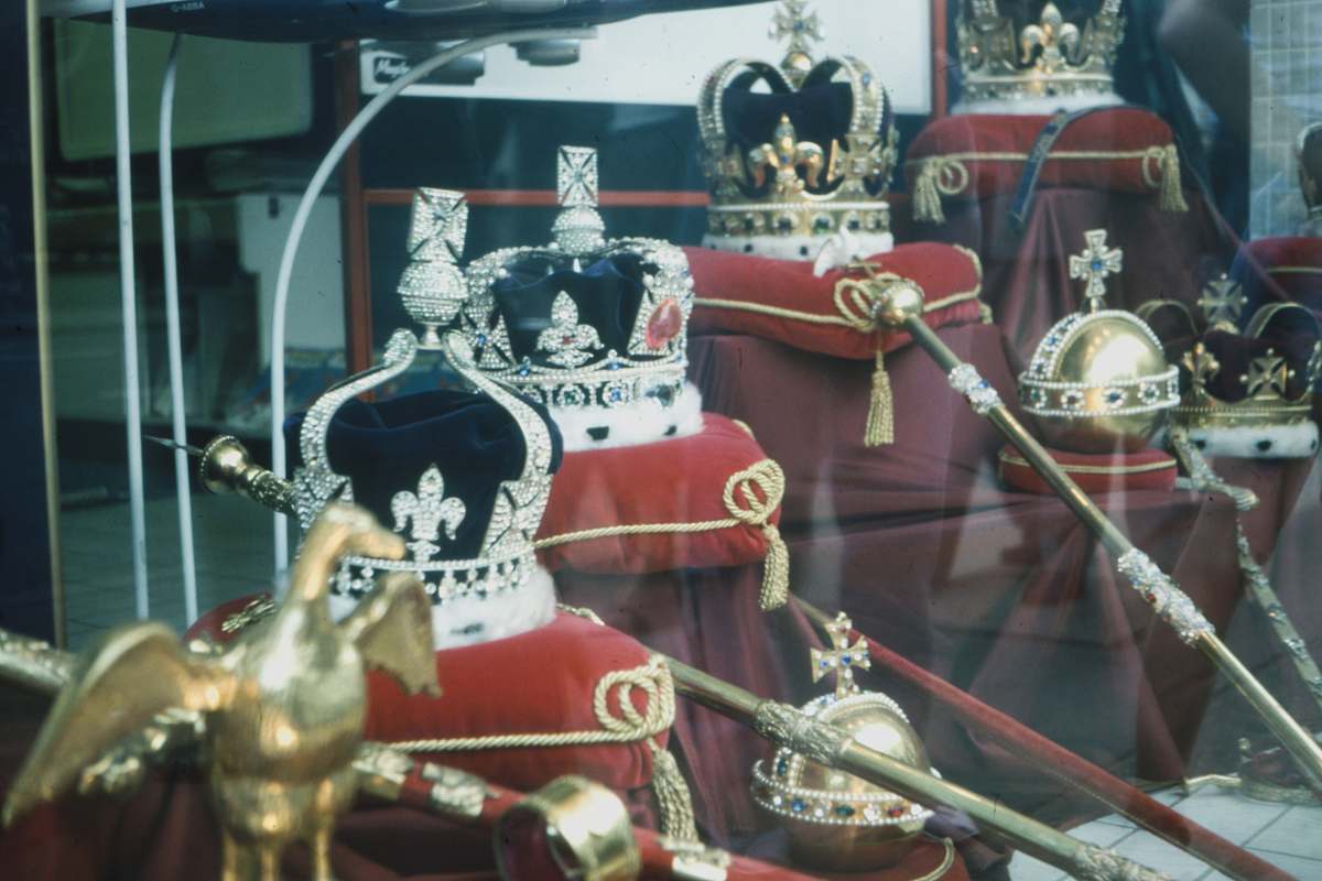  gold and red trophy on glass shelf 