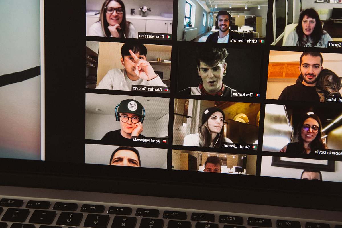 macbook pro displaying woman in black shirt 