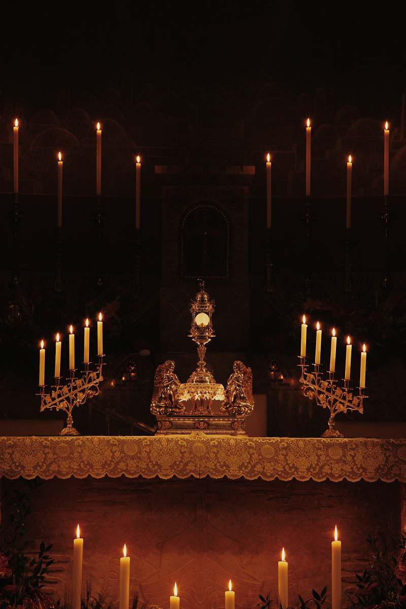 altar lighted candles inside building church