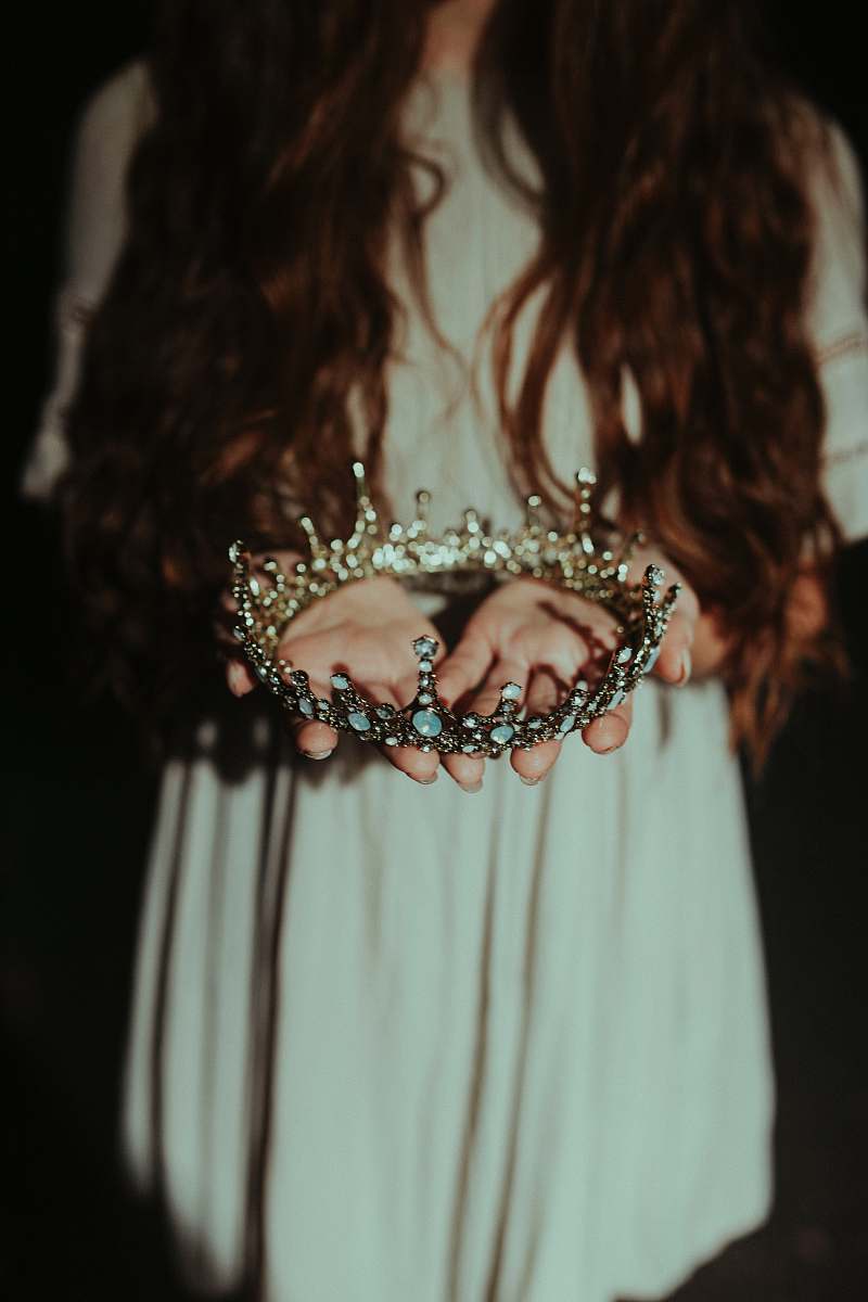 crown woman holding silver-colored crown people