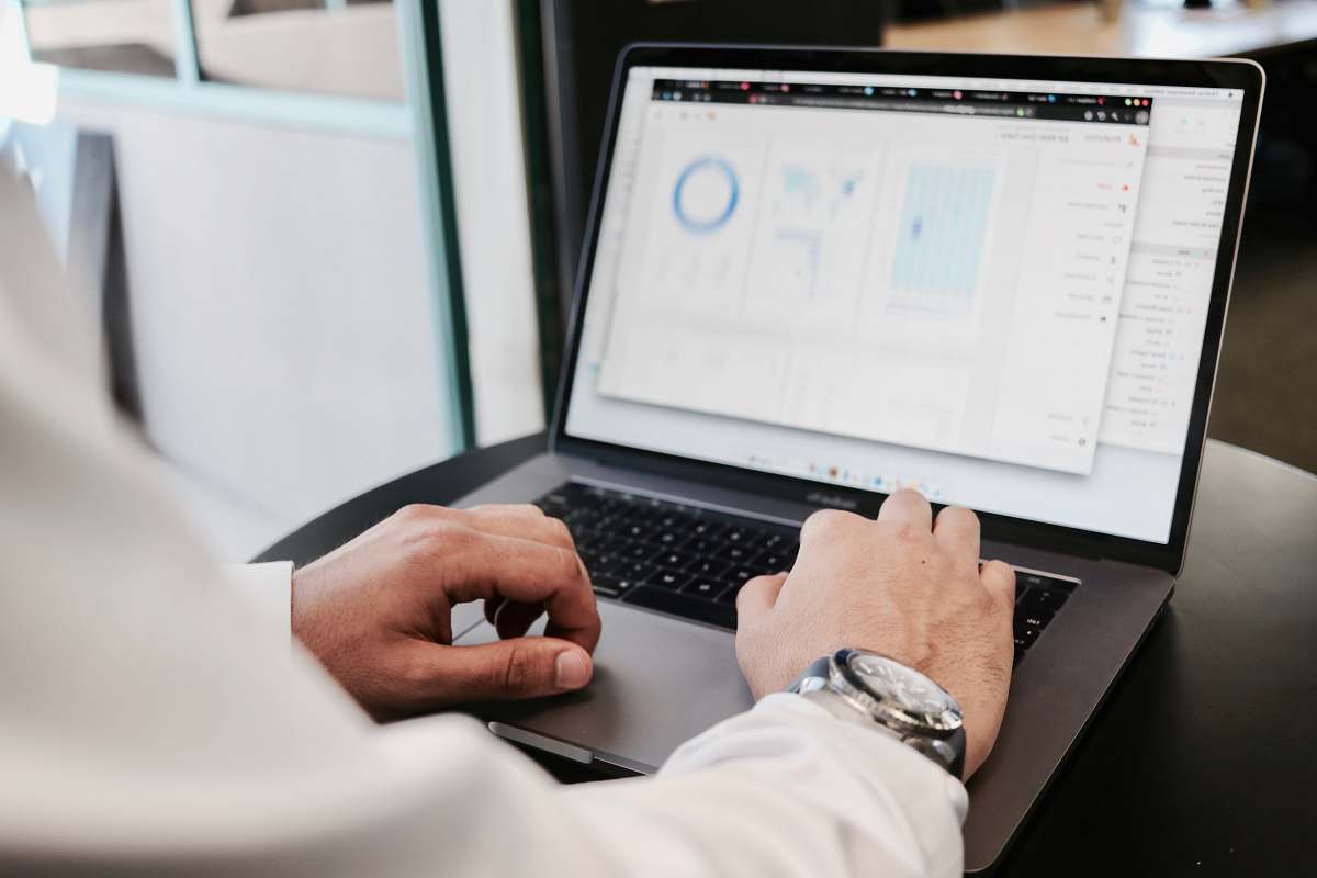 shirt person using MacBook Pro businessman