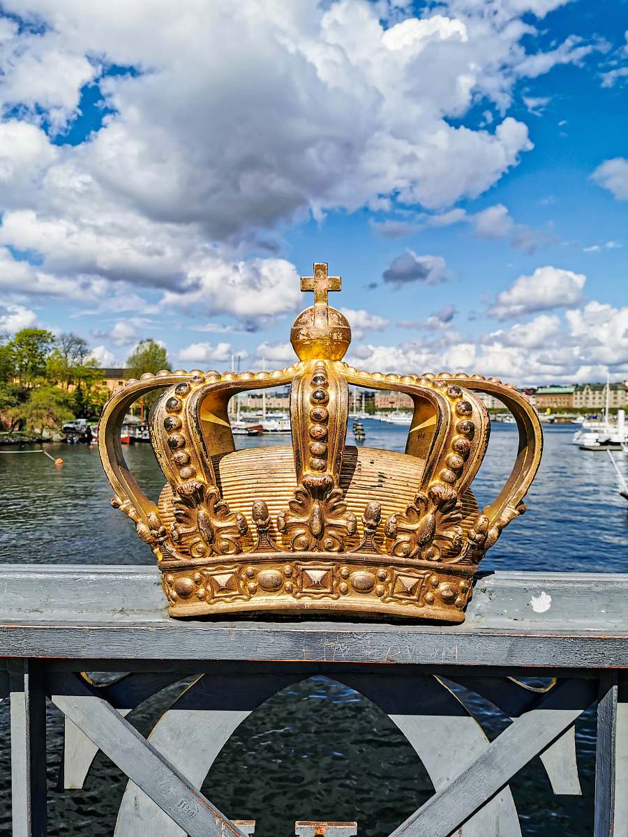 waterfront gold crown with a cumulus clouds in the background dock