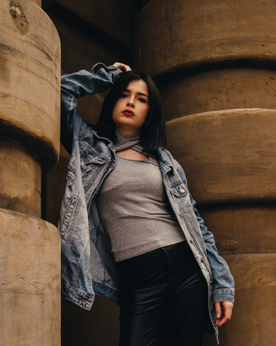 sleeve woman leaning on wall clothing