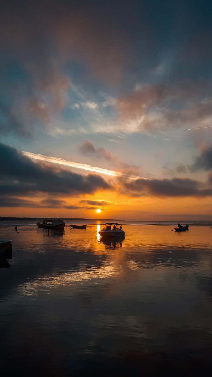 sunset people in boat nature