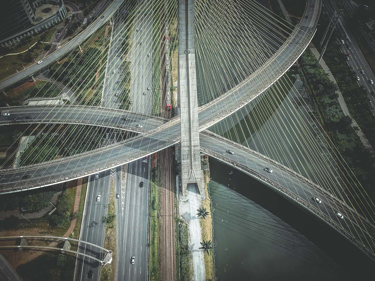 grey aerial view of concrete road and bridge bridge