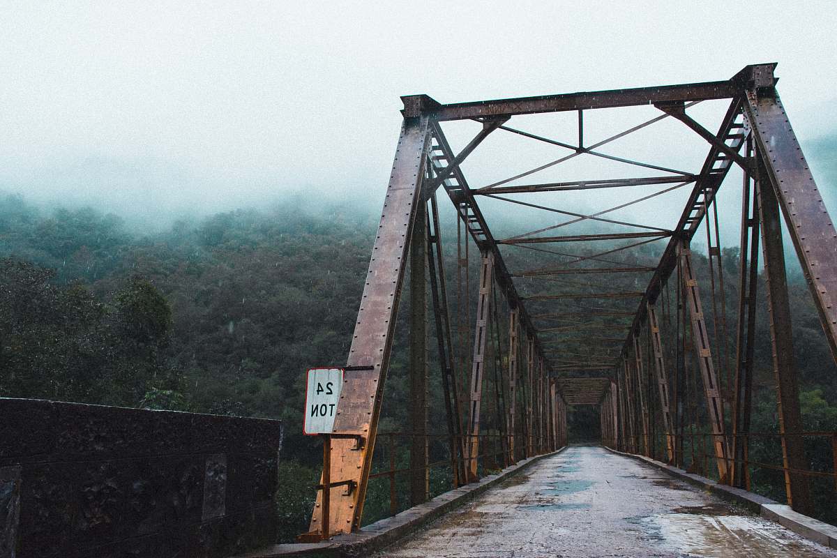 bridge high bridge near green forest covered with fog nova roma do sul