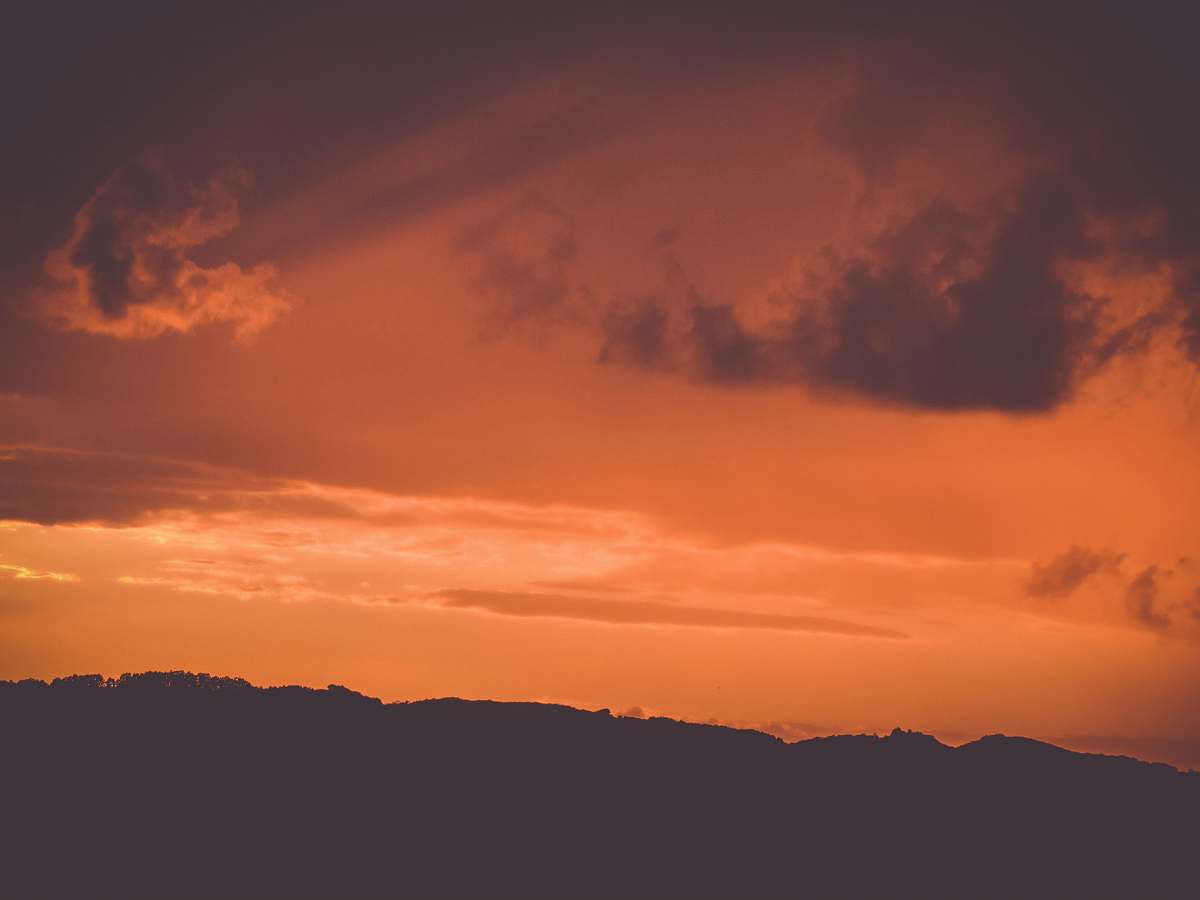 nature silhouette of mountains during golden hour sunset