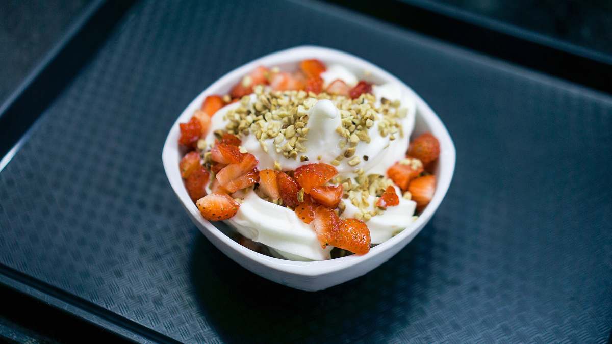 meal strawberry with cream on bowl food