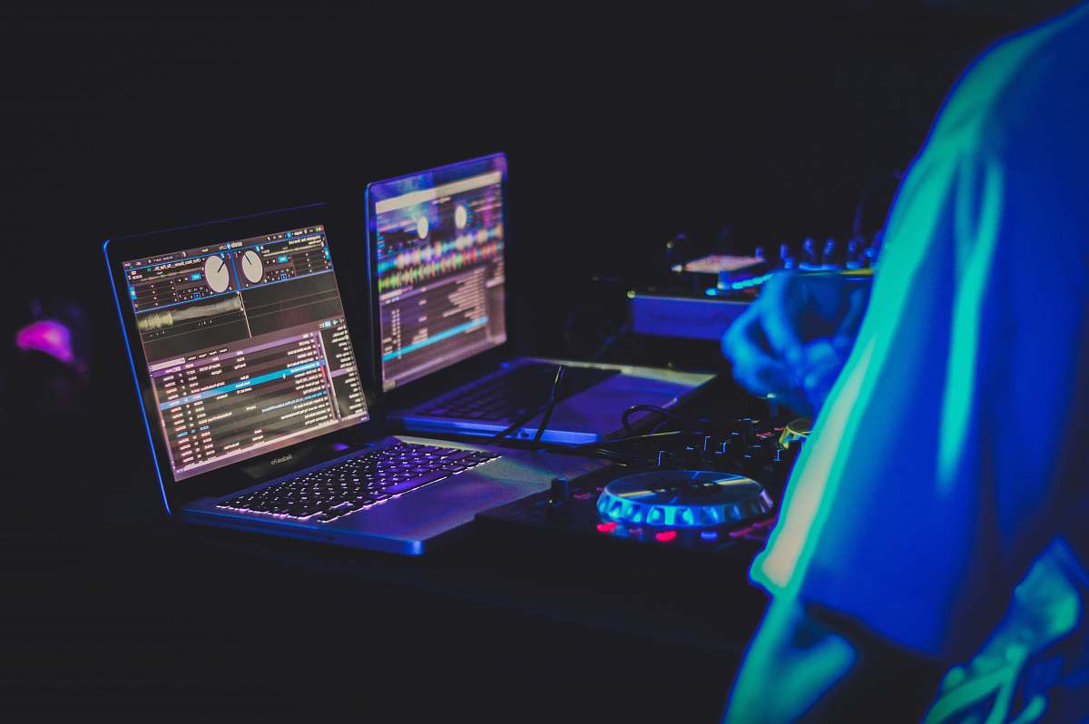 dj two laptop computers and DJ turntables music