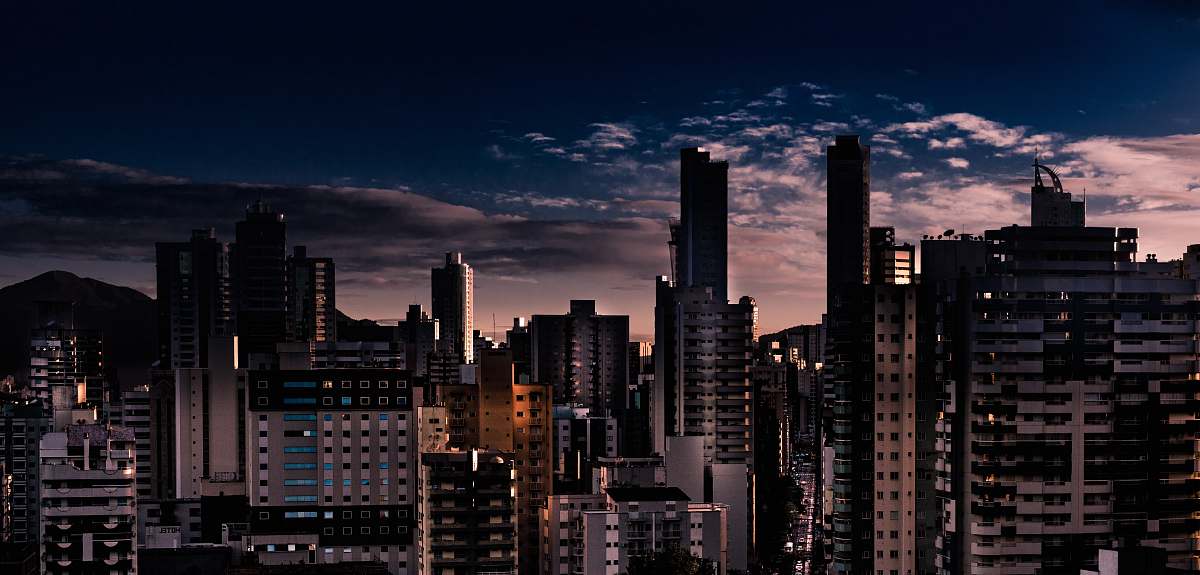 town city building photo across clouds urban