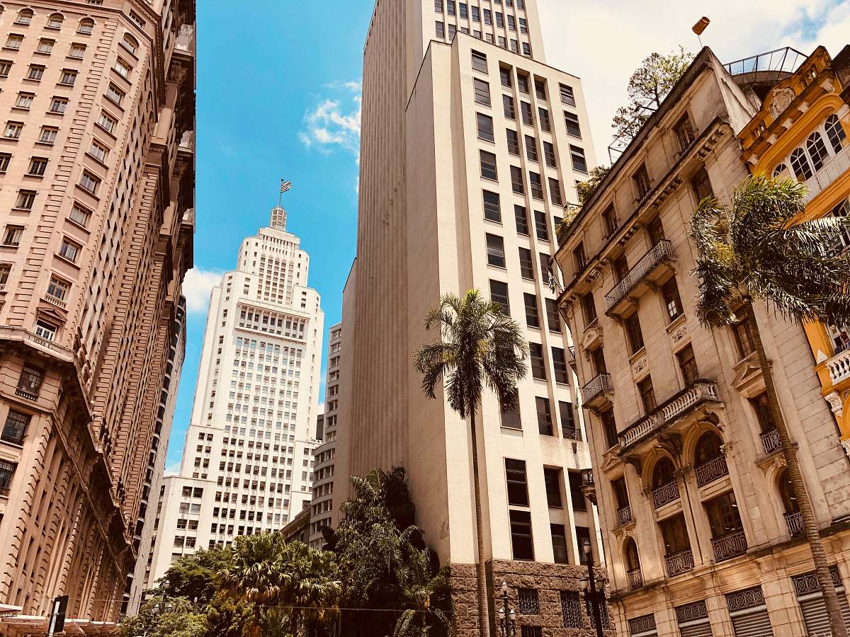 city low angle photo of white building skyscraper