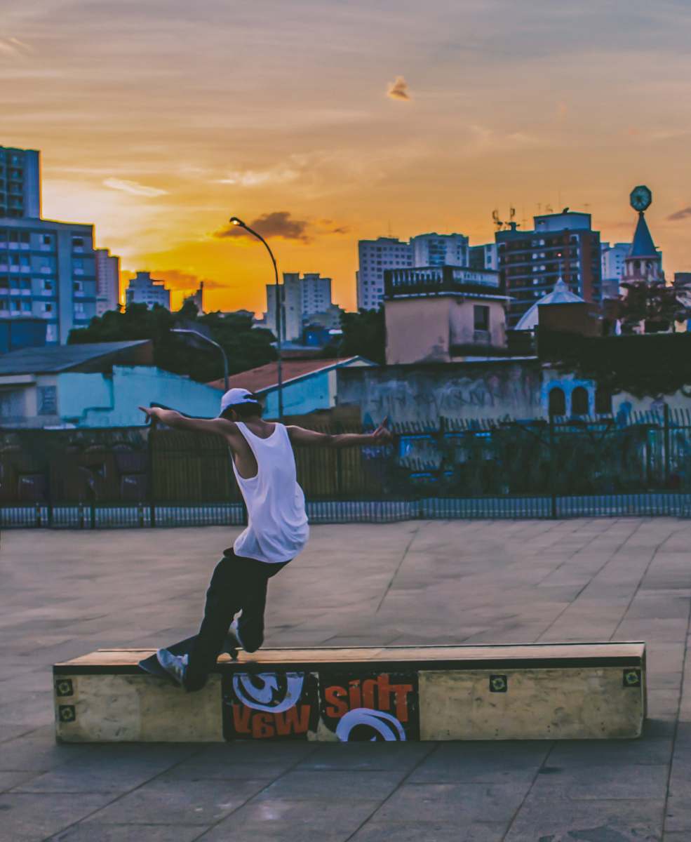 person man doing tricks on skateboard brazil