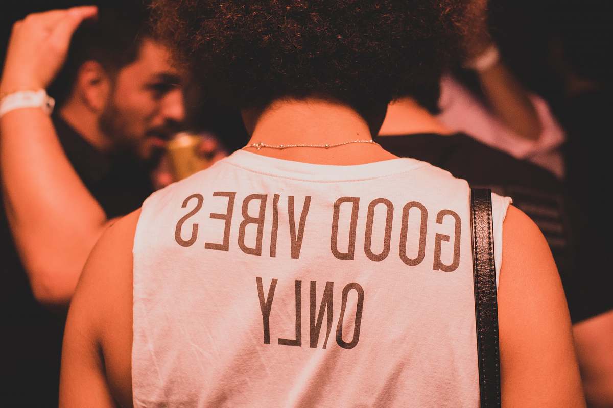 person photo of person wearing white and brown good vibes only shirt people