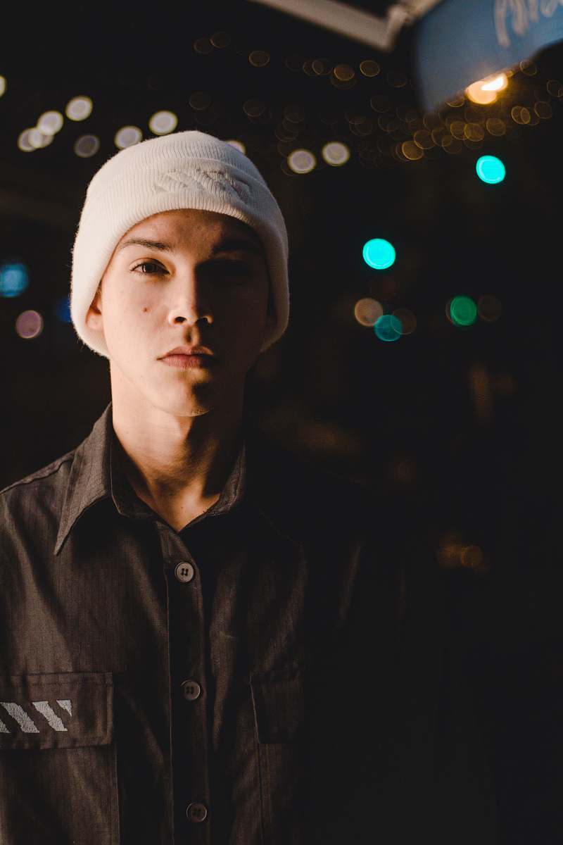 person standing man wearing white knitted cap people