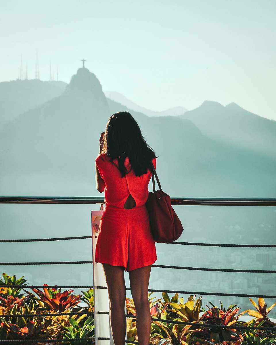 apparel woman looking to the mountain during daytime clothing