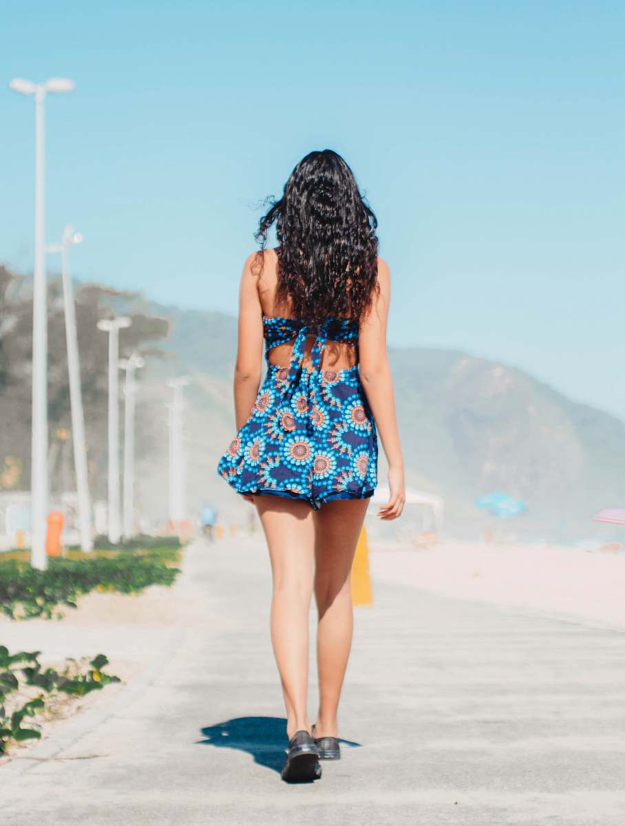 clothing woman wearing blue and brown floral mini dress apparel