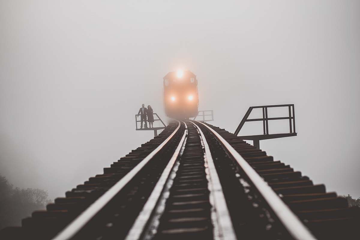 brazil man and woman standing beside trailway fog