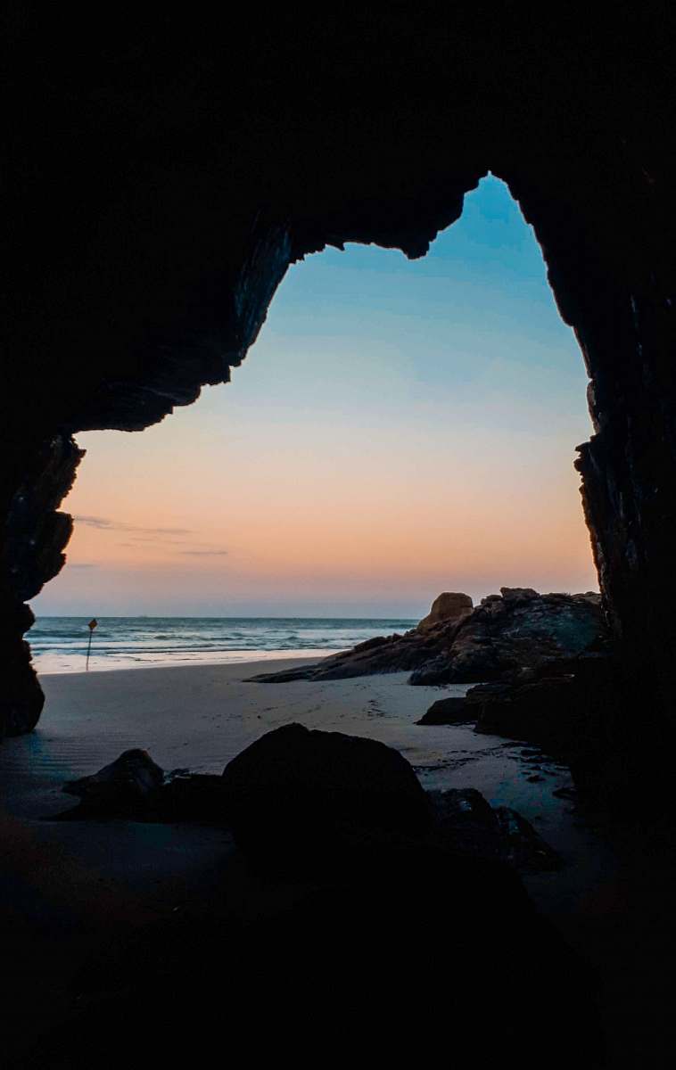 water seashore at daytime cave
