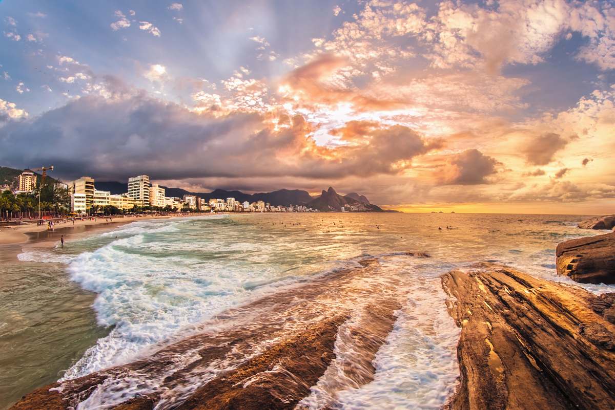 coast seashore near city under cloudy skies sea