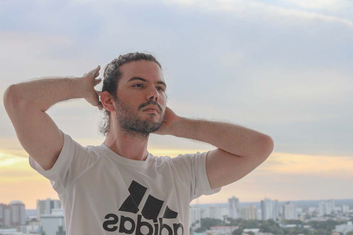 apparel man holding his hair clothing