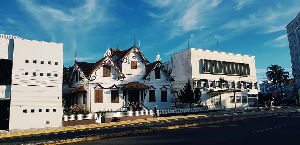 building white house near buildings house