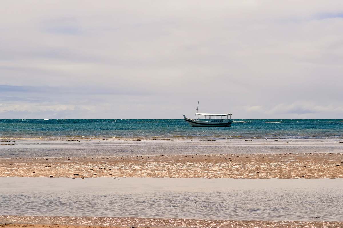 transportation white and black boat on sea under white and blue skies boat