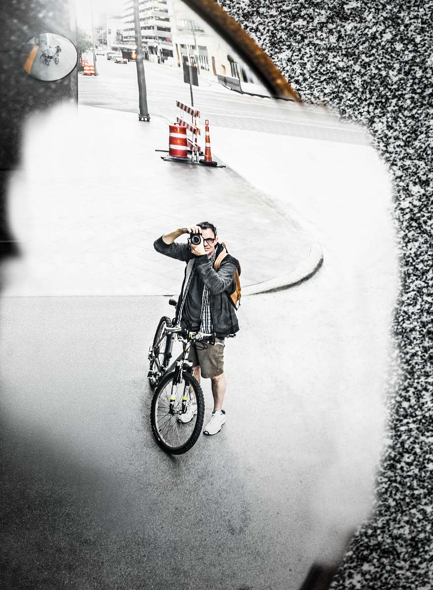 bike man standing beside bicycle during daytime transportation