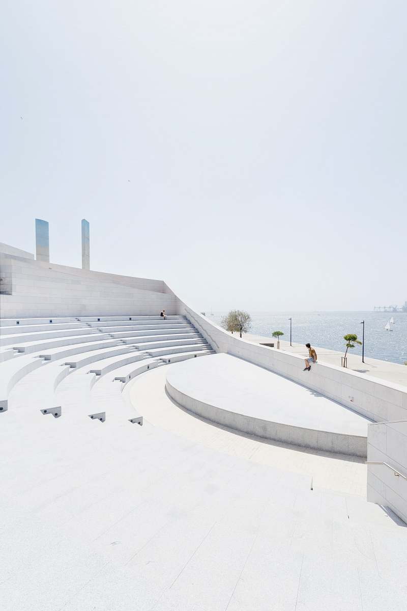 architecture man sitting on wall building