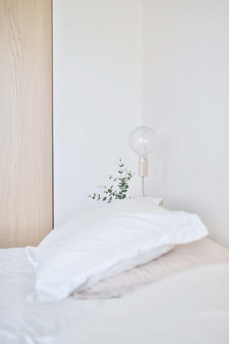 pillow white bed pillow near table lamp cushion