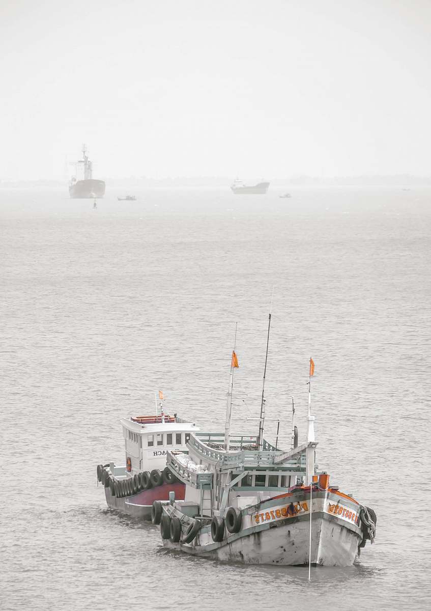vehicle white and green ship on sea during daytime vessel