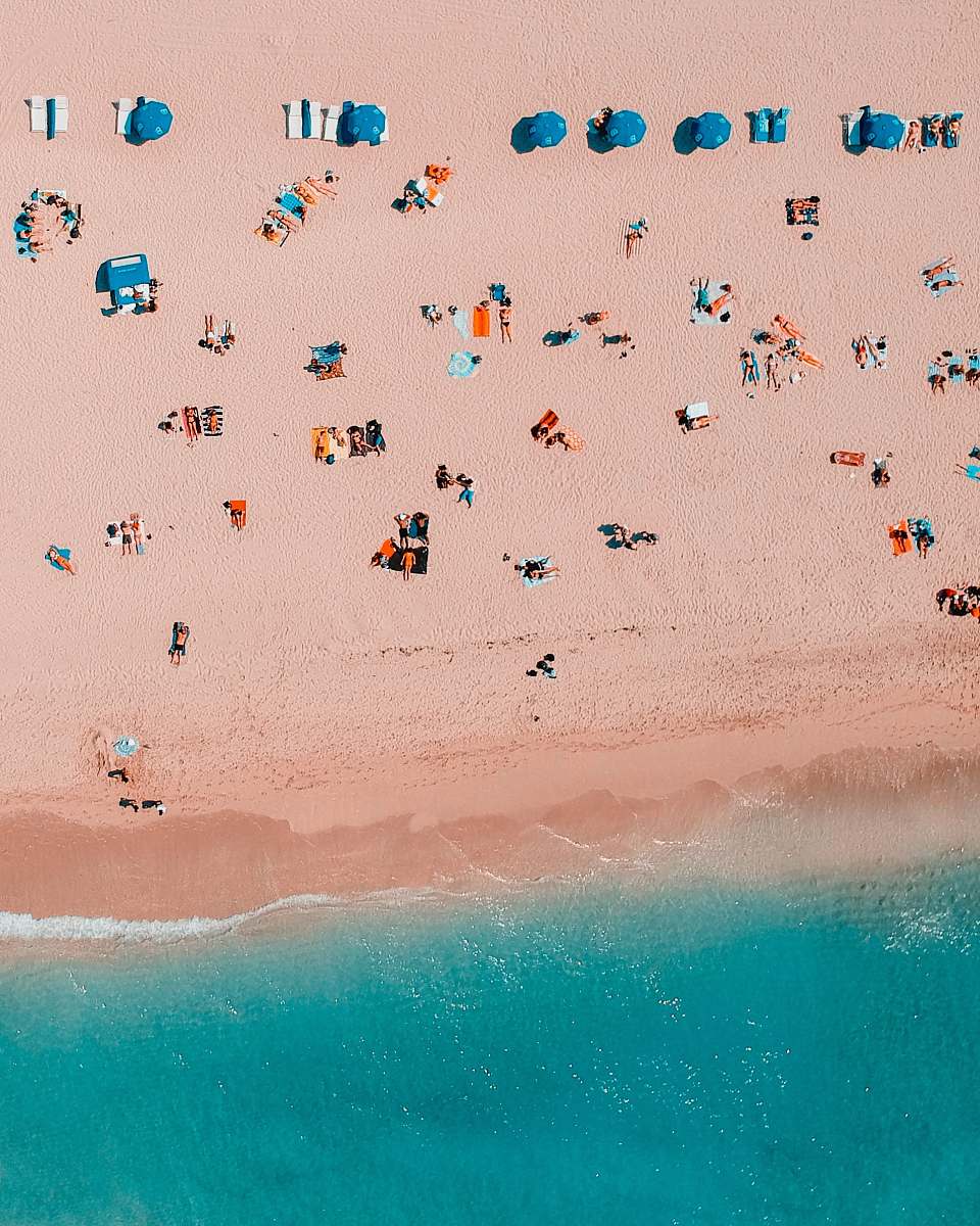 beach bird's-eye view photography of people in seashore coast