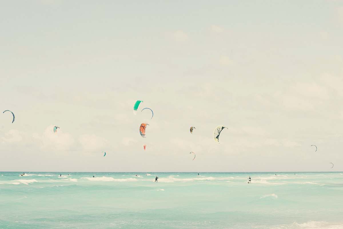 kite many people parachuting during daytime grey