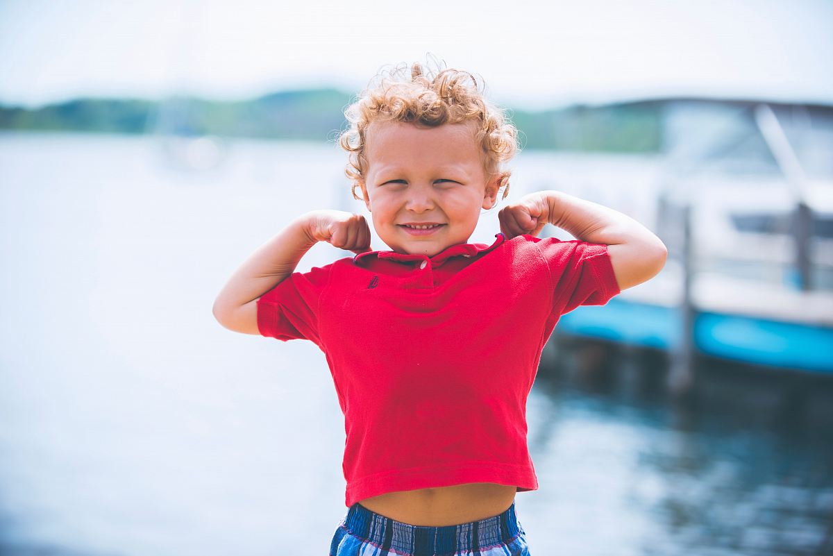boy standing near dock