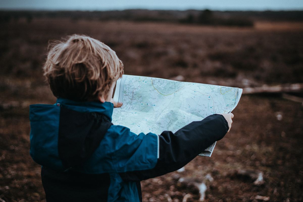 child looking at map