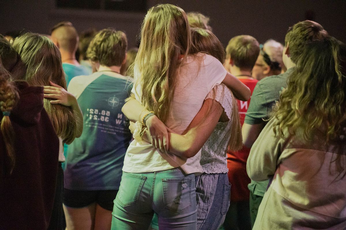 group of people hugging themselves