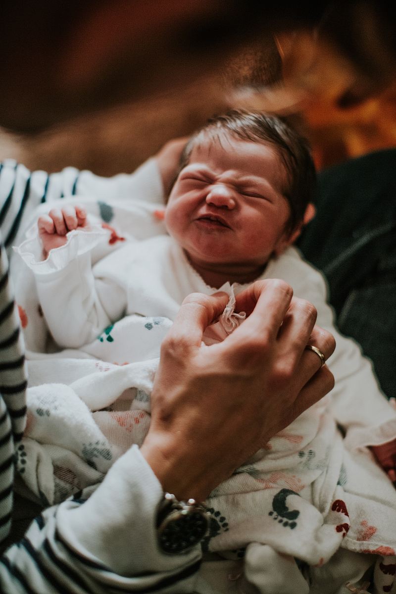 person carrying baby