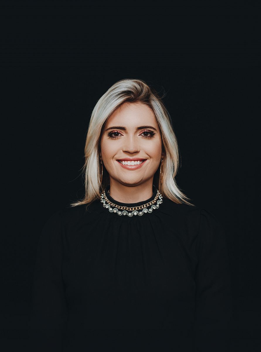 smiling woman wearing black crew-neck top