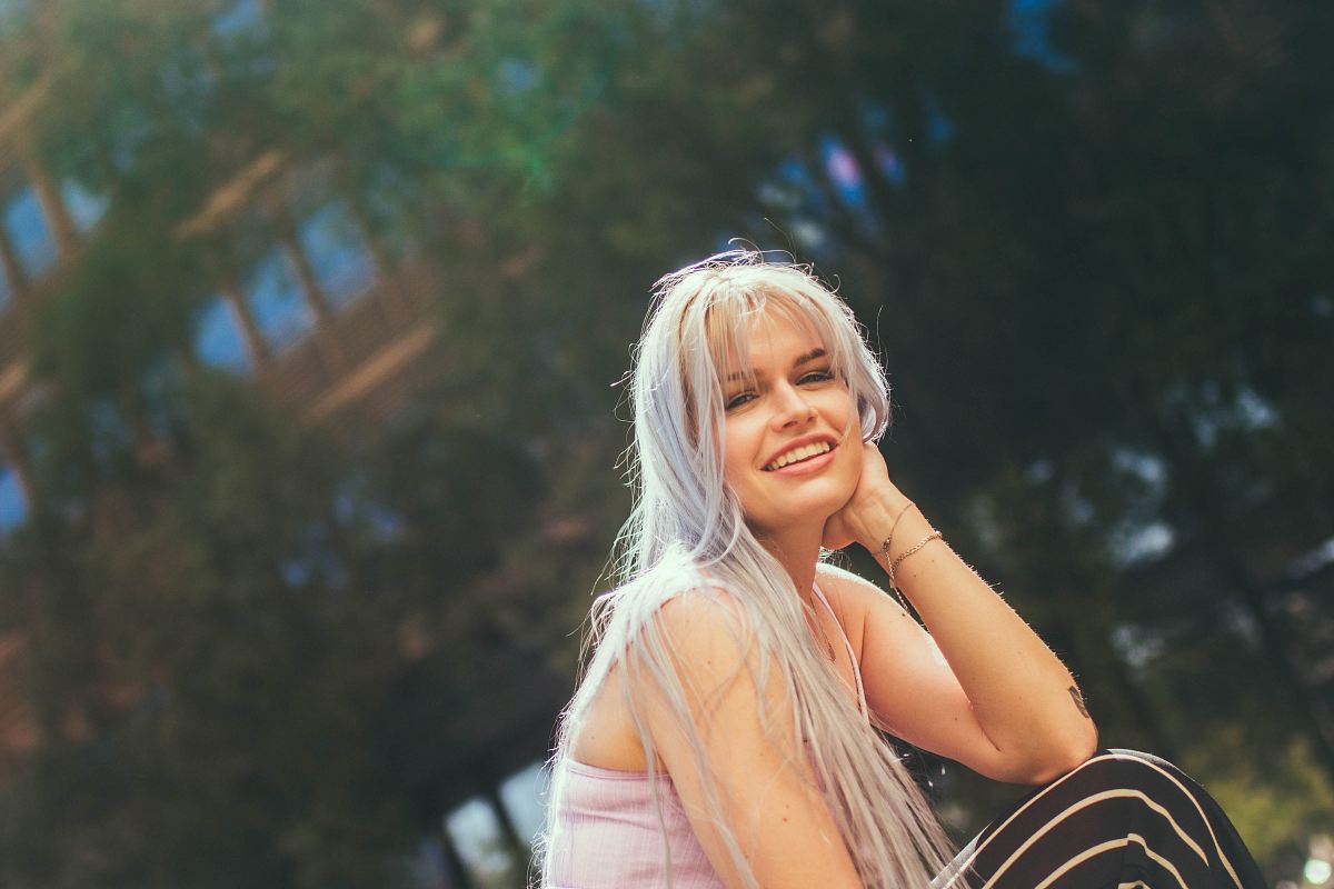 woman in pink top smiling