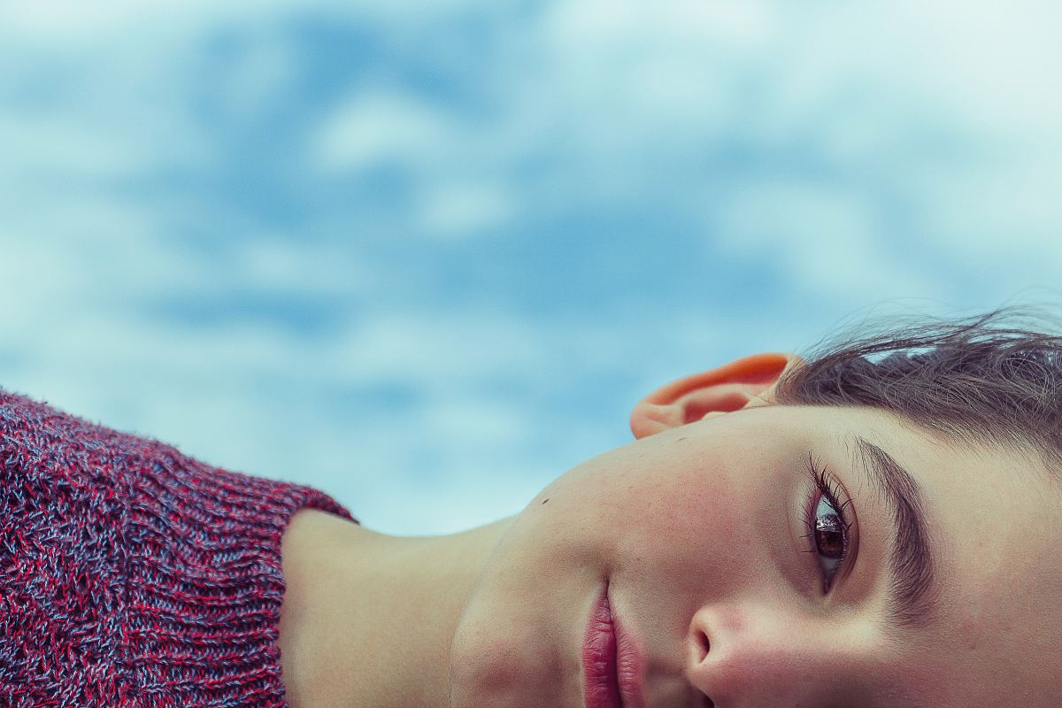 woman wearing red knit top