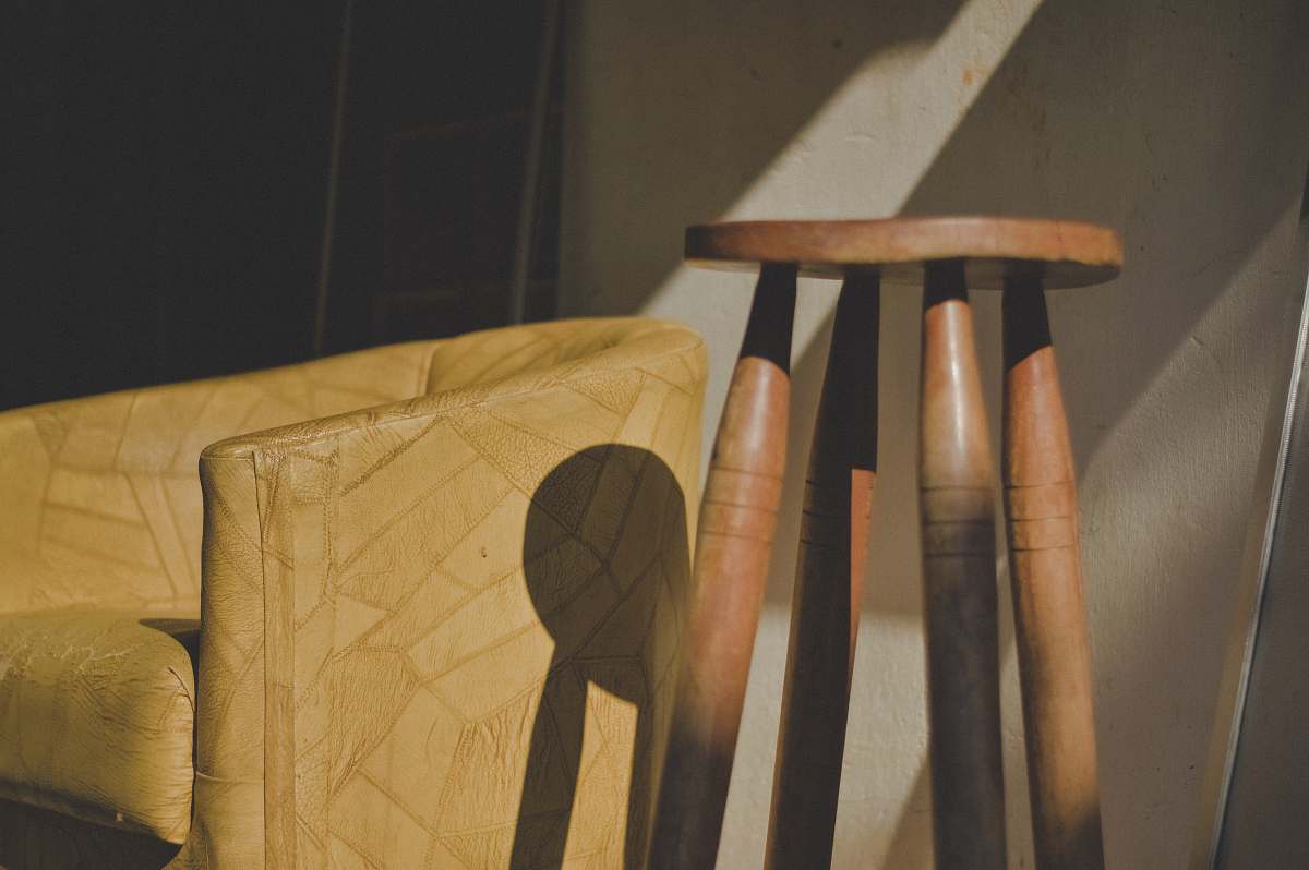 wood brown wooden stool near barrel chair hortolândia