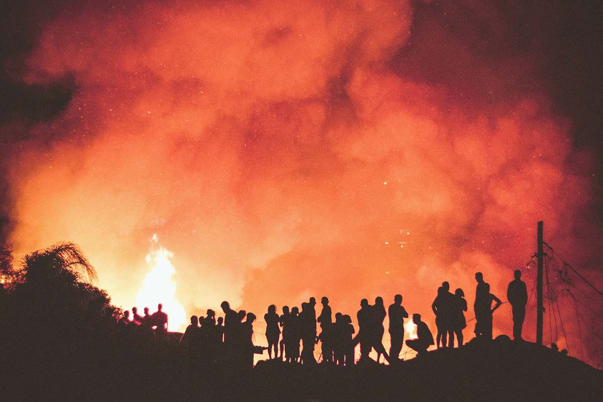 fire people near bonfire during night orange