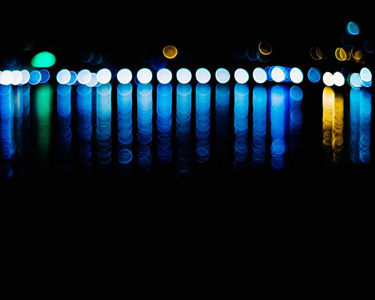 Immerse yourself in this captivating selective colors photography featuring a striking lamp that illuminates against a deep black background. The vibrant hues of the lamp create a mesmerizing contrast, making this image ideal for use in interior design blogs, advertising campaigns, or as a striking piece in modern art collections. Perfect for those looking to add a touch of elegance and creativity to their projects.