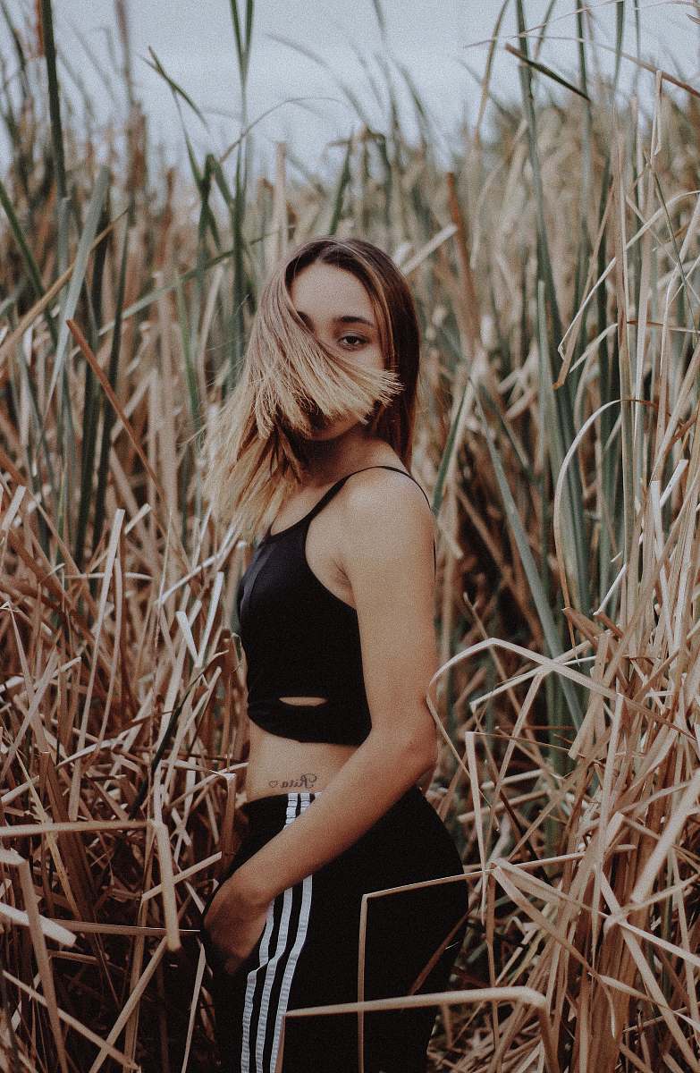 woman woman at grass flipping her hair female