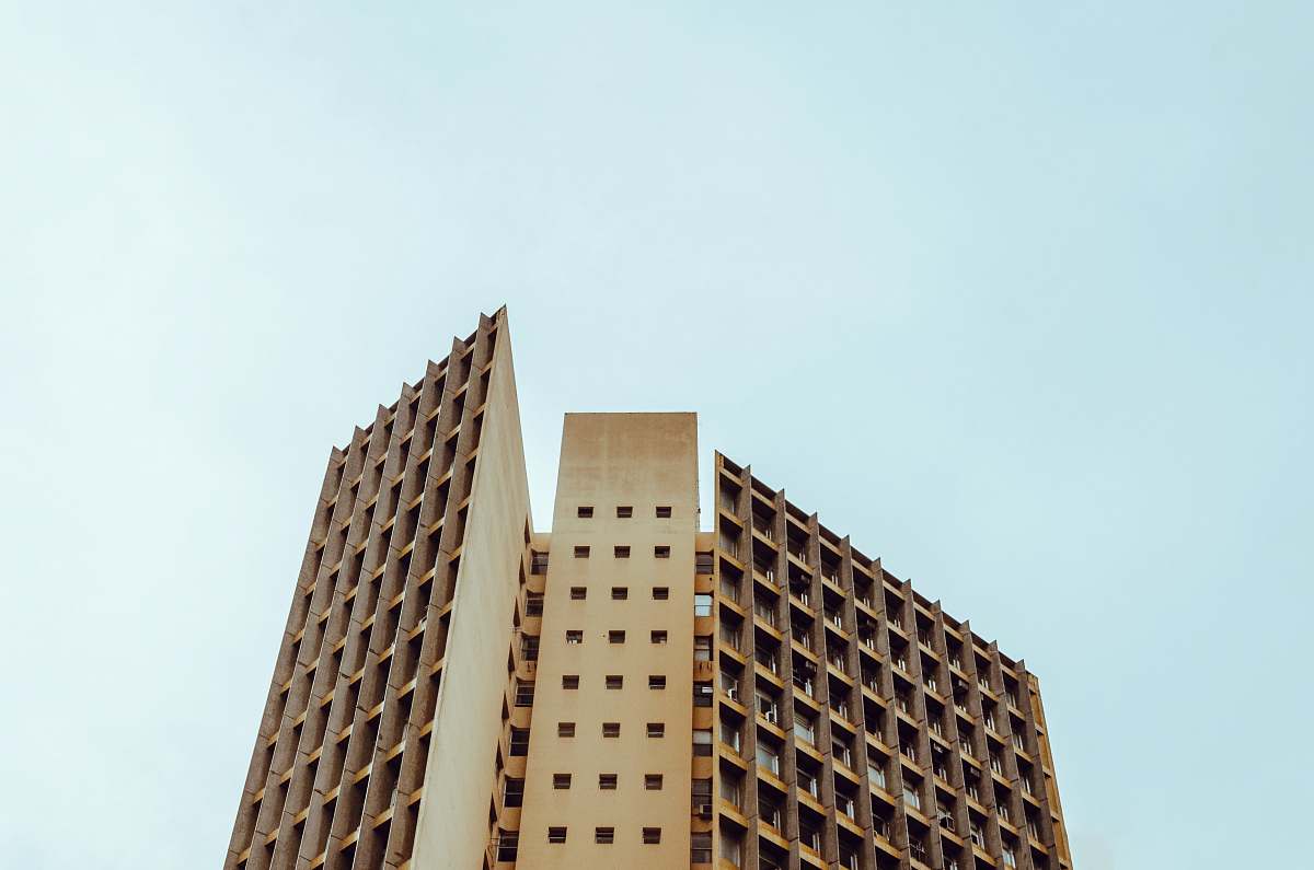 urban low angle photography on brown building city